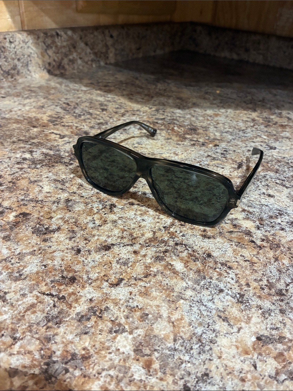 Saint Laurent Black Frame Sunglasses with Dark Green Lenses